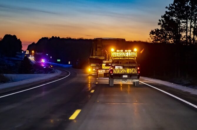 escort vehicle behind oversized load